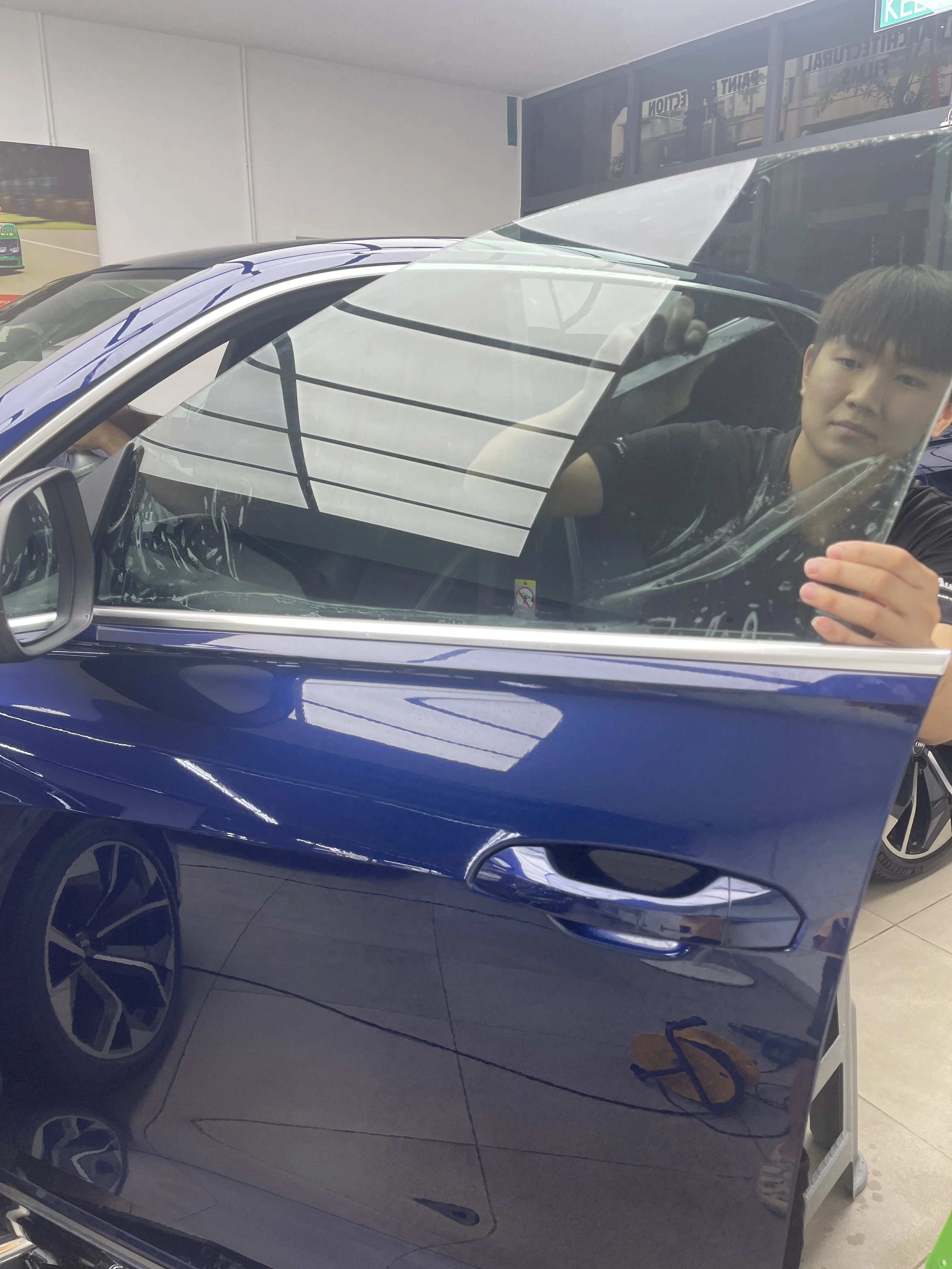 Automotive window film being installed at WG Detailing