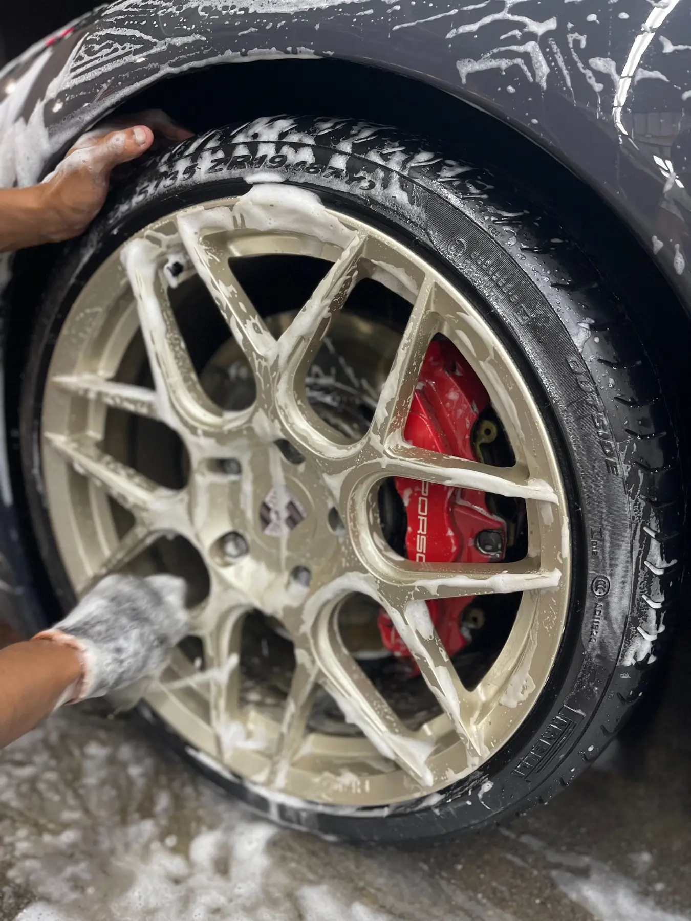 Detailed wheel cleaning during a premium wash